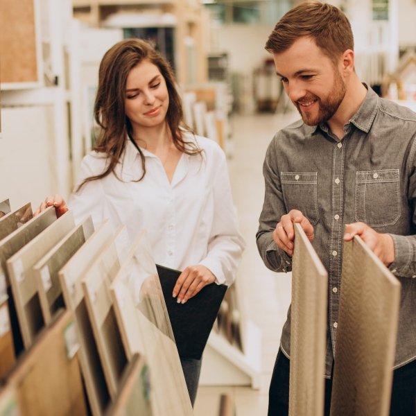 young couple looking at flooring samples at Carpet Center in Huron, SD